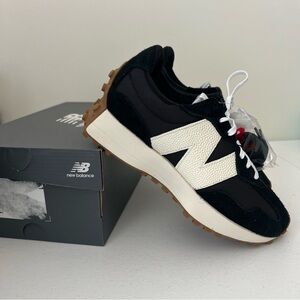 New Balance Woman’s Black and White Sneakers